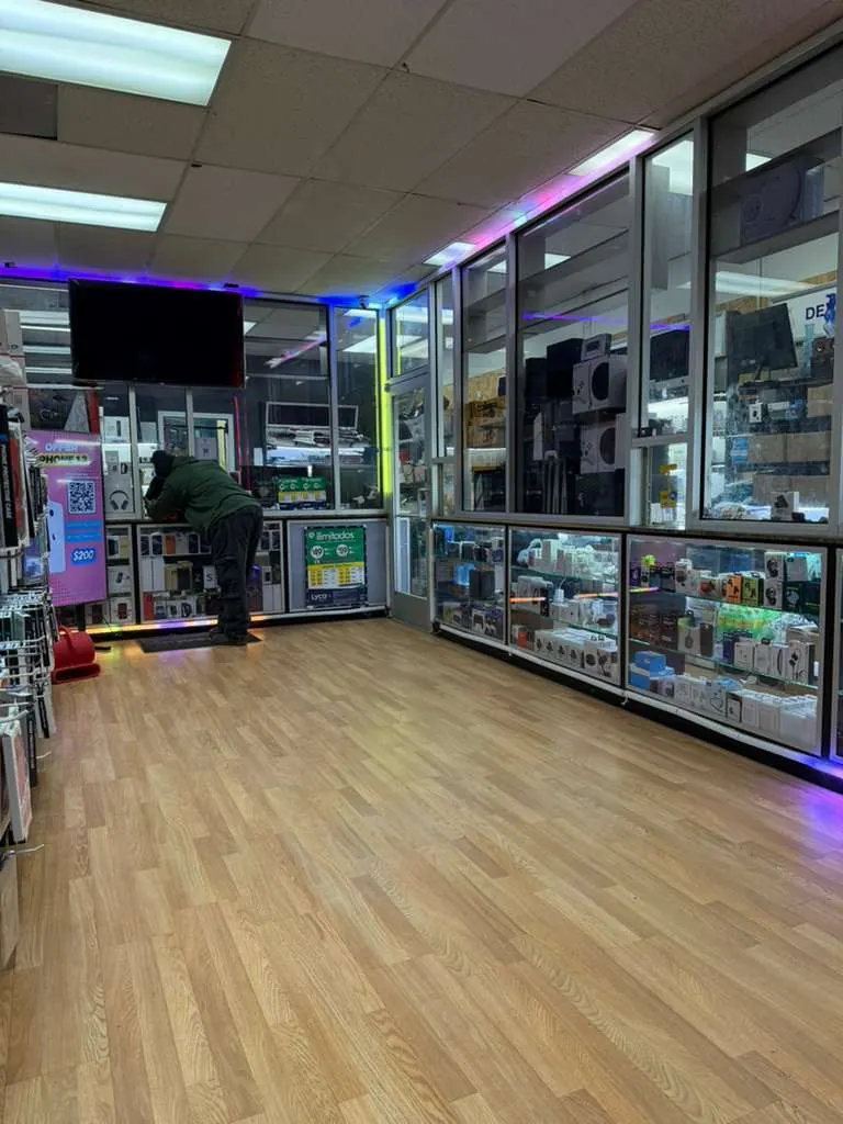 Inside the Phone King Unlocks store, with display cases of phones and accessories